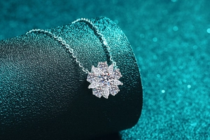 Close-up of S925 sterling silver sunflower pendant with marquise moissanite petals