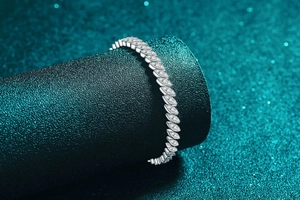 Detailed close-up of marquise link bracelet with sparkling moissanite stones