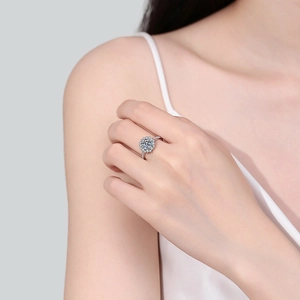 S925 sterling silver sun flower moissanite ring with round cut center stone on a model