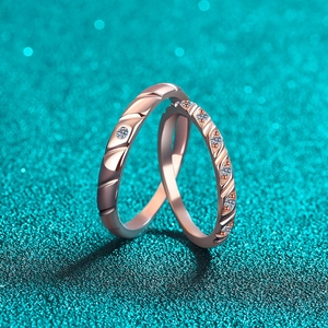 Moissanite couple ring set in champagne gold with elegant diagonal spiral texture