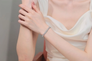 Detail of S925 sterling silver moissanite bracelet with marquise cut stones on wrist