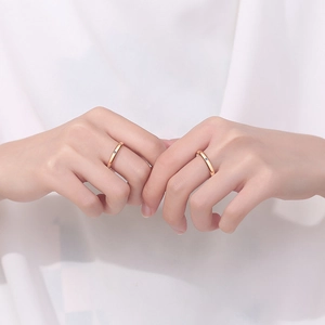 Minimalist pair of champagne gold S925 silver couple rings featuring small blue gemstones