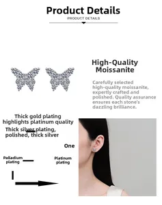 Macro detail of silver butterfly earrings with moissanite inlay and polished finish