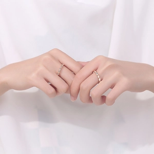 S925 sterling silver moissanite couple rings in rose gold finish on a model's hand