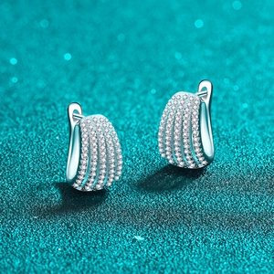 Elegant S925 sterling silver moissanite hoop earrings with pavé diamonds on a shimmering teal background