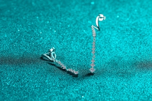 Close-up of S925 sterling silver tassel earrings with sparkling moissanite stones