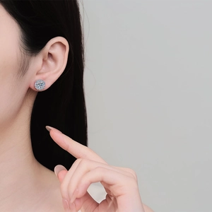Elegant S925 sterling silver halo moissanite stud earrings on female model