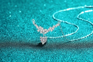 Macro shot of S925 sterling silver heart pendant necklace with moissanite diamonds