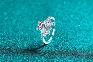 Macro shot of S925 sterling silver heart moissanite ring with floral petal setting