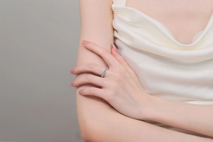 Macro detail of elegant S925 sterling silver moissanite ring worn on a model's hand