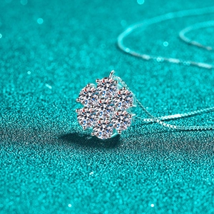 S925 sterling silver sunflower moissanite necklace with a box chain on green background