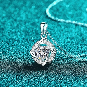 S925 sterling silver heart vortex necklace with moissanite pendant on blue glitter