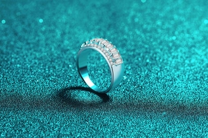 Macro shot of S925 silver ring featuring baguette-cut and pavé-set moissanite stones