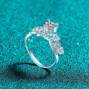 Elegant S925 sterling silver crown ring with heart-cut moissanite on blue background