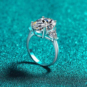 Elegant S925 sterling silver ring with oval moissanite and triangle side stones