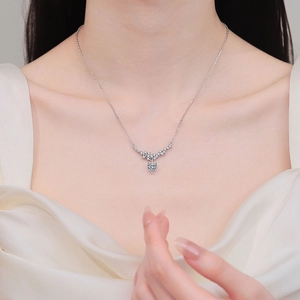 Elegant S925 sterling silver moissanite necklace featuring a V-shaped heart pendant on a model