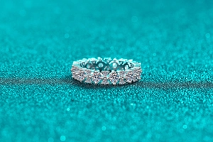 Macro close-up of S925 sterling silver eternity ring with sparkling moissanite stones