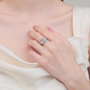Luxurious S925 sterling silver moissanite ring with floral design on a model's hand