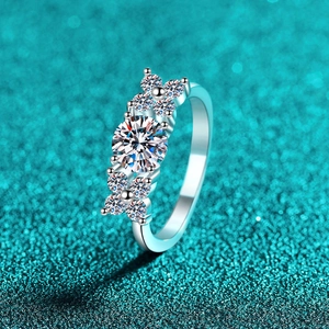 Elegant S925 sterling silver moissanite ring with floral side stones on blue background