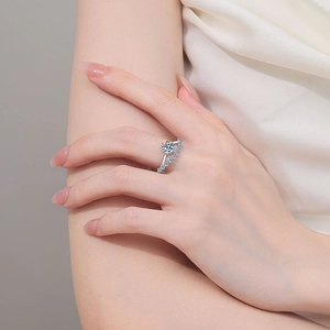 Elegant S925 sterling silver moissanite ring with a wavy diamond band on a finger