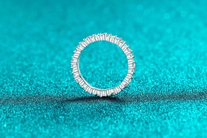 Macro detail of S925 sterling silver stamp on a sparkling full moissanite eternity ring