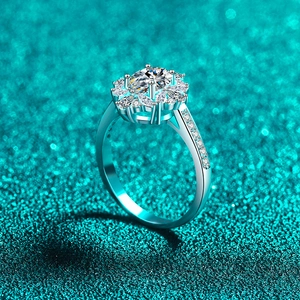 Luxurious S925 silver oval moissanite ring with floral halo design on a blue background
