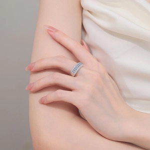 Elegant S925 sterling silver band ring with blue and white stones on a finger