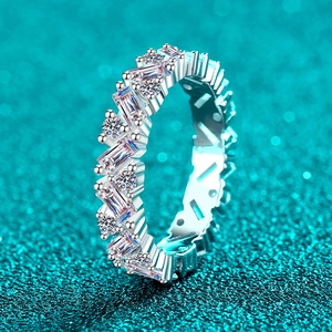 Luxurious S925 silver ring with baguette and round moissanite stones on a blue background
