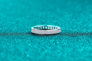 Detailed view of S925 sterling silver eternity ring with square cut moissanite stones