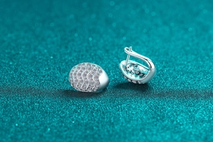 Macro shot of S925 sterling silver hoop earrings with pave set moissanite stones