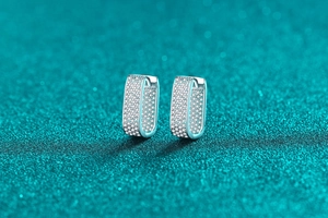 Detailed view of S925 sterling silver U-shaped hoop earrings with micro-pave moissanite stones