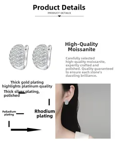 Detail of Moissanite wave hoop earrings in S925 sterling silver with a polished finish