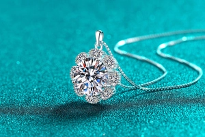 Macro shot of sparkling moissanite sunflower pendant with elegant silver box chain