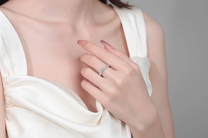 Close-up of elegant S925 sterling silver moissanite eternity band ring on model finger
