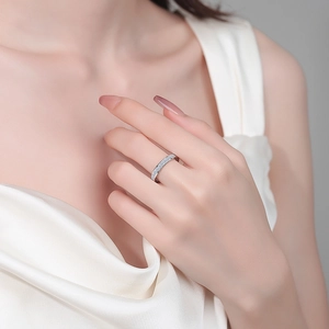 Elegant S925 sterling silver eternity ring with moissanite pavé on a model hand