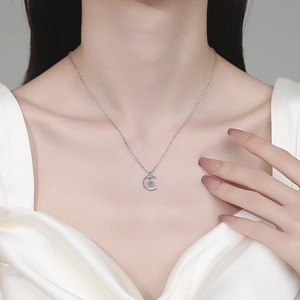Elegant S925 sterling silver crescent moon necklace with moissanite pendant on a woman