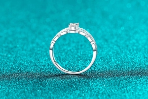Detailed macro view of S925 sterling silver ring with moissanite and hollow chain design