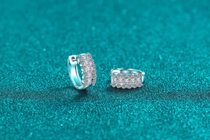 Macro shot of S925 sterling silver hoop earrings with pavé set moissanite stones