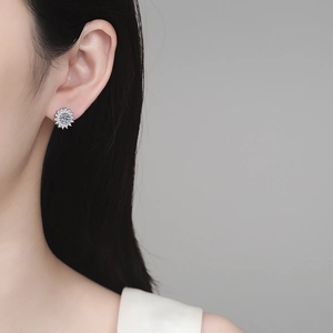 Elegant S925 sterling silver maple leaf moissanite stud earring worn by a female model