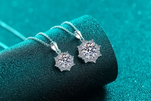 Macro shot of S925 sterling silver flower pendants with moissanite center stones