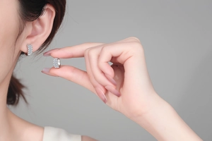 Close-up of S925 sterling silver hoop earrings with micro-pave moissanite stones