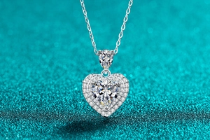 Macro shot of S925 silver heart necklace featuring a halo-set moissanite stone