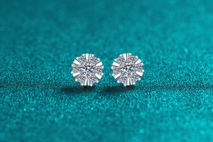 Detail of 925 sterling silver moissanite sunflower studs with sparkling stones