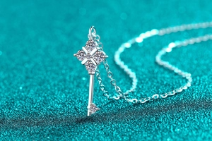 Macro view of S925 sterling silver key pendant featuring brilliant moissanite stones