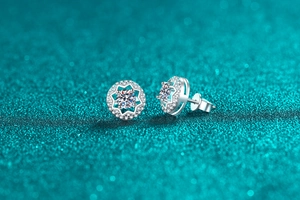 Detailed view of S925 sterling silver star-shaped moissanite studs with pavé micro-diamonds