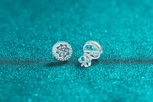 Macro shot of S925 silver moissanite star earrings with halo design and butterfly back