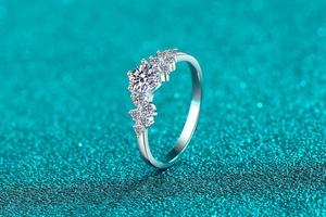 Macro detail of S925 sterling silver ring with cluster moissanite and clear round stone