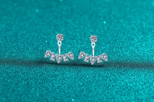 Close-up of S925 sterling silver moissanite jacket earrings with fan-shaped zircon drops