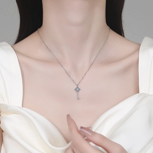 Elegant S925 sterling silver key pendant necklace with moissanite accents for women