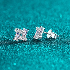 Elegant S925 sterling silver baguette moissanite stud earrings on blue textured surface